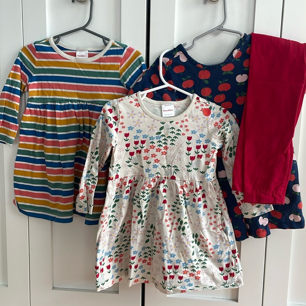 Three 2T Hanna Andersson dresses plus one pair of leggings.